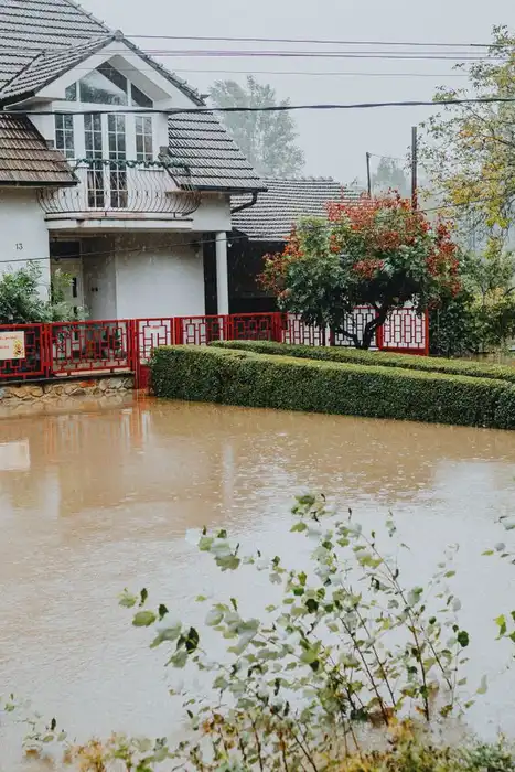 House and front yard surrounded by floodwater